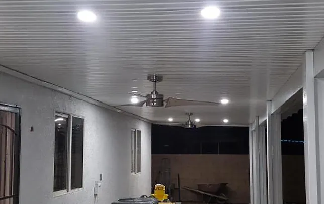 Lit covered patio at night