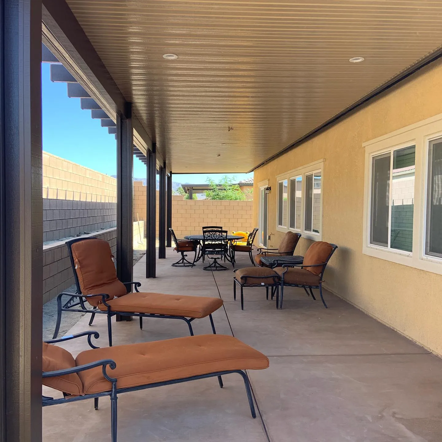 Covered patio lounge with furniture
